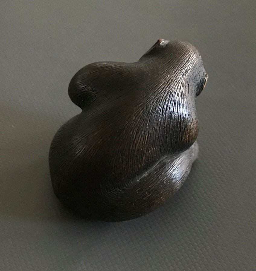 Wood netsuke of monkey picking a flea