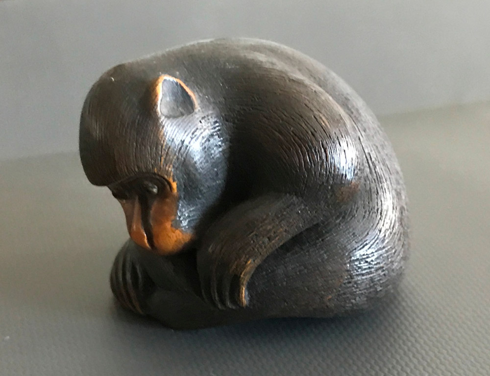 Wood netsuke of monkey picking a flea